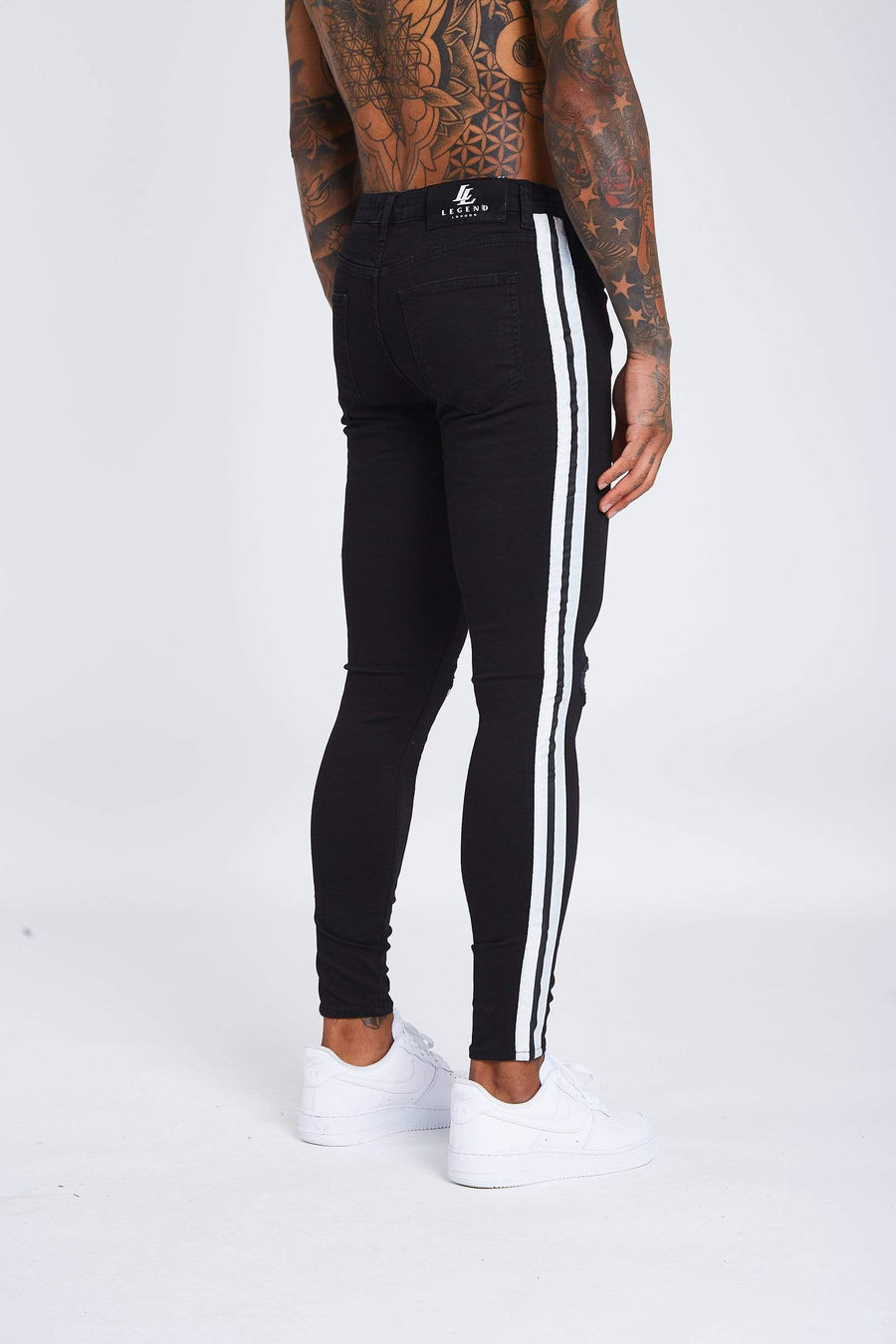 Black jeans discount with white stripe